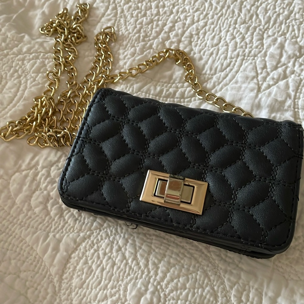 Small black quilted purse with gold tone chain shoulder crossbody